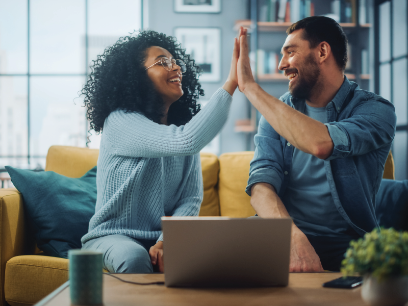 Two people giving a celebratory high-five.