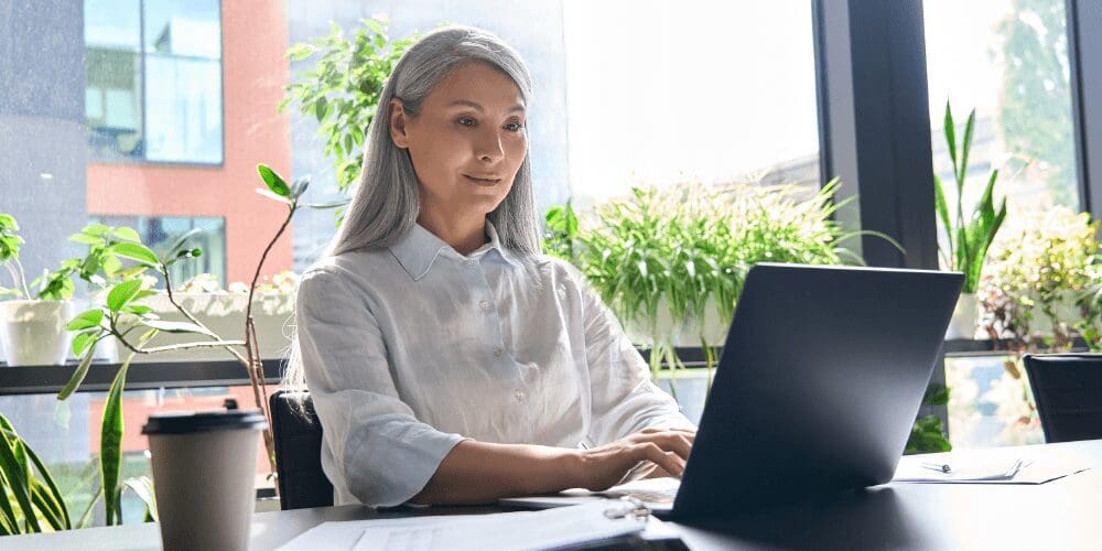 Woman working on her laptop.