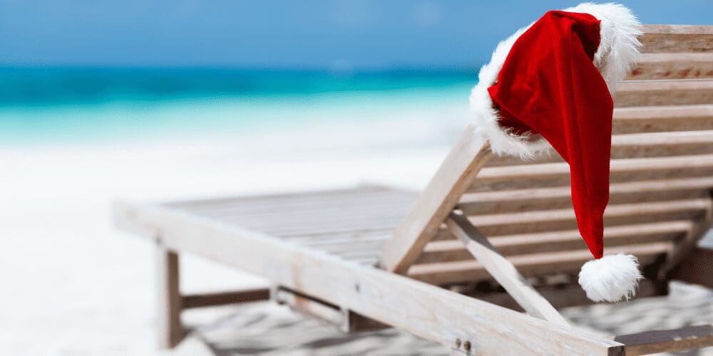 Chair at the beach with Santa hat