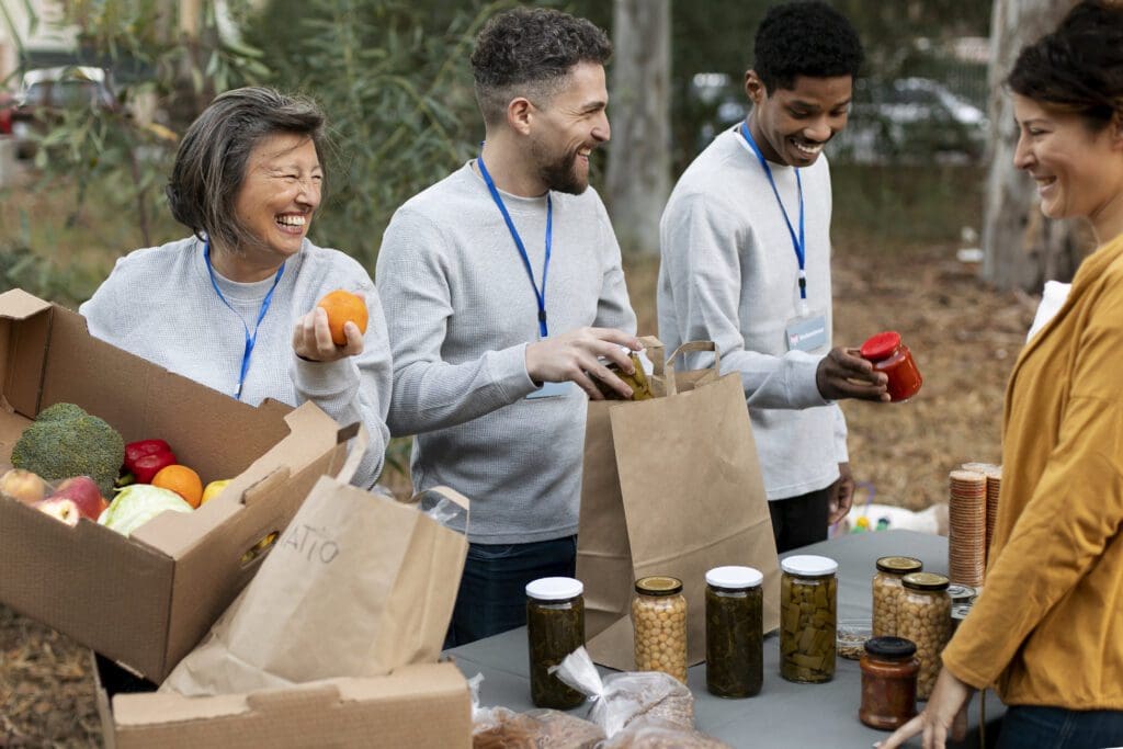 close up people collecting food philanthropy
