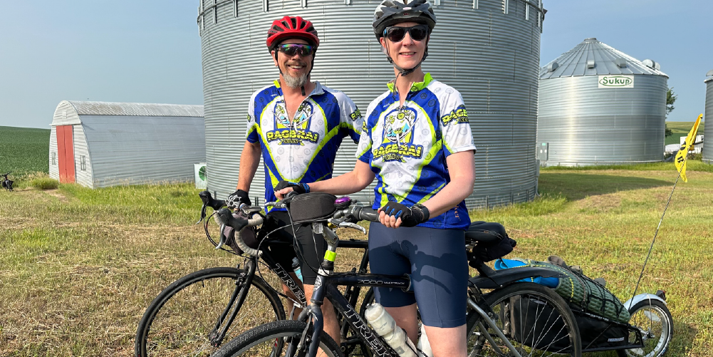 solvers smiling for picture riding their bikes