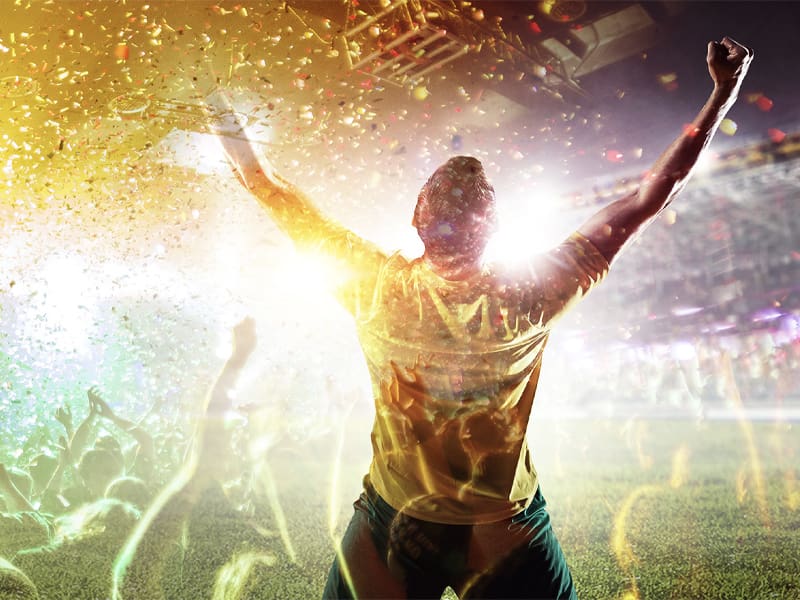 Excited Man Celebrating While Facing a Large Crowd With Arms in the Air – Resource Thumbnail