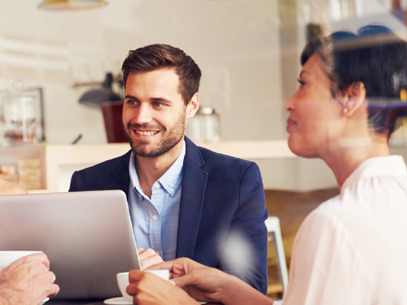 Employees working together at a table