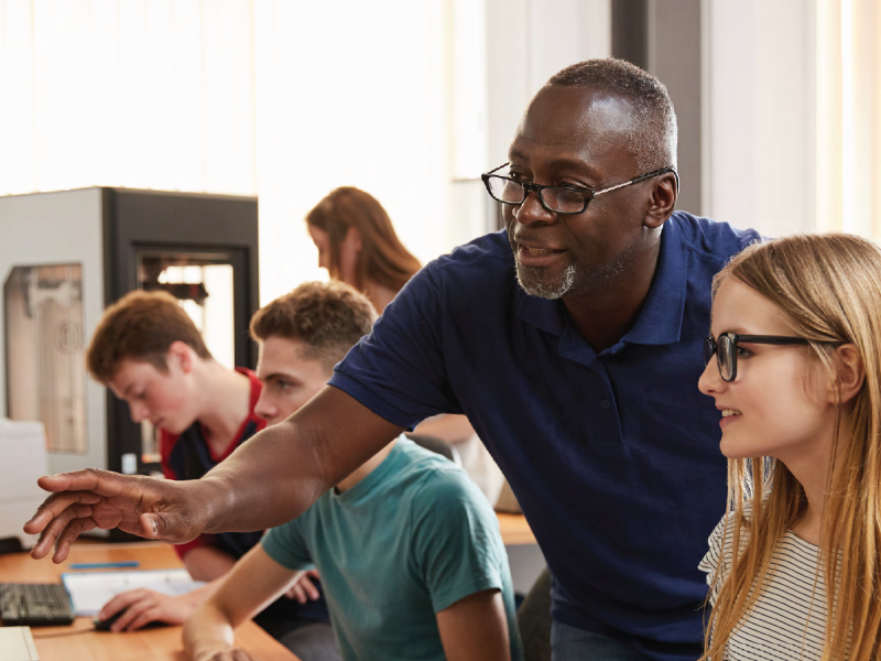 Colleagues discussing online work together