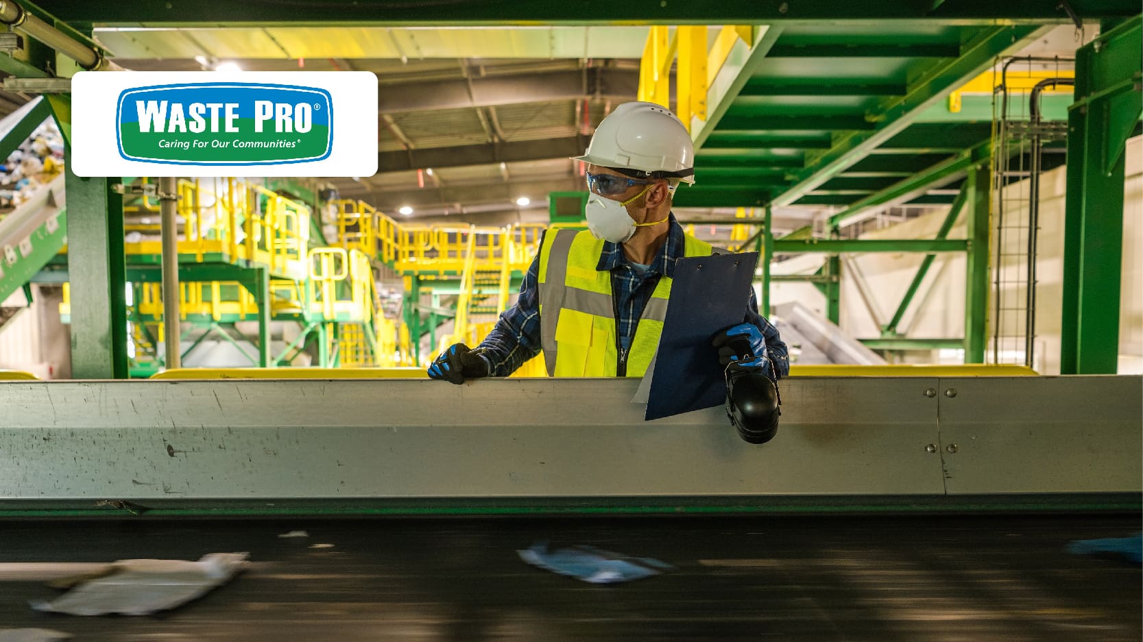 Waste Pro Case Study Resource Image - Waste Management Worker Checking on Running Trash Material on Conveyor