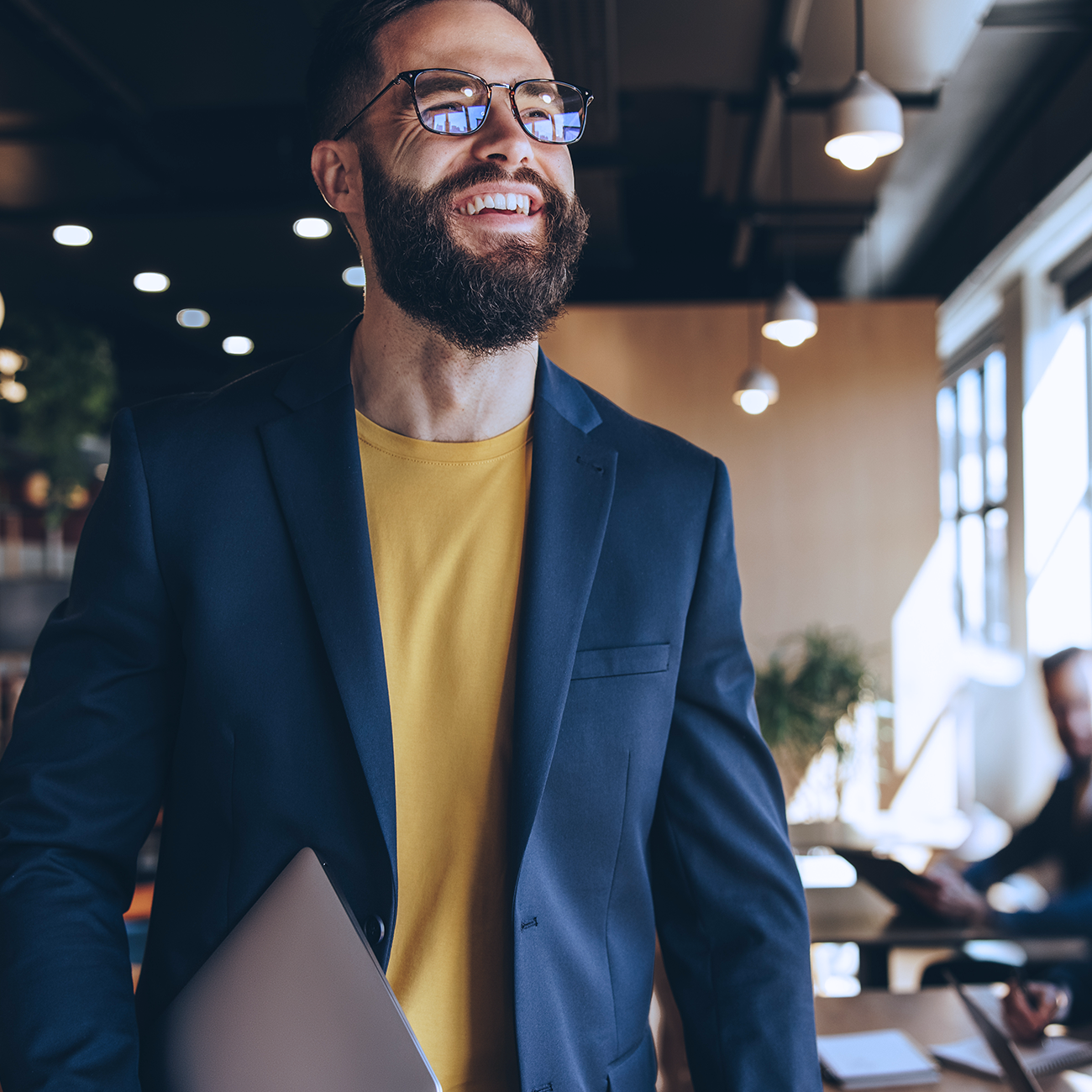 Man smiling at a professional environment