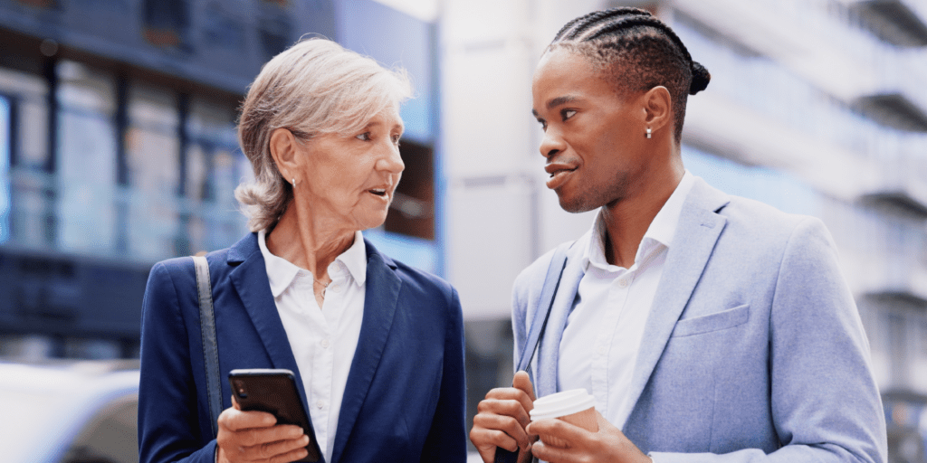 Diverse coworkers having a conversation on a walk