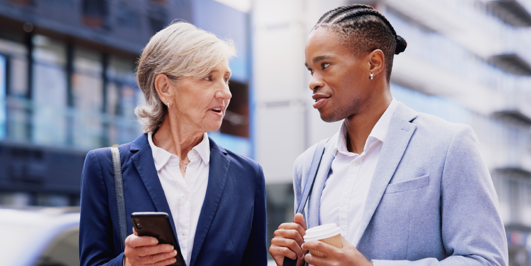 Diverse coworkers having a conversation on a walk