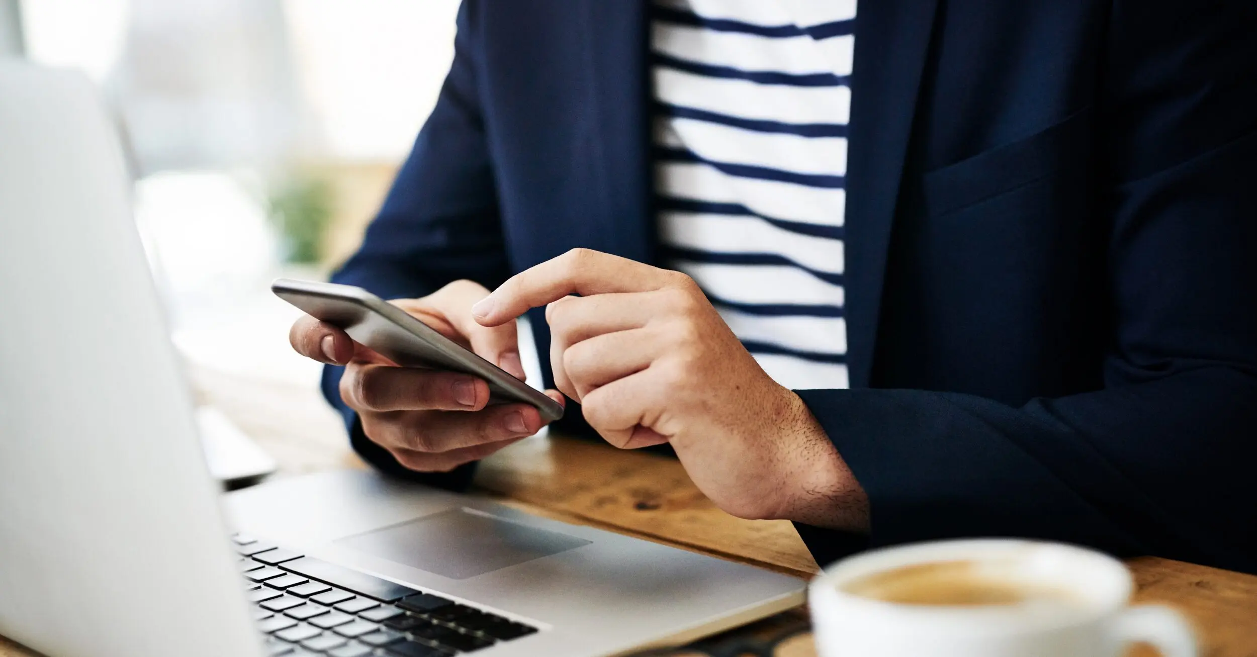 Woman typing on a cellphone