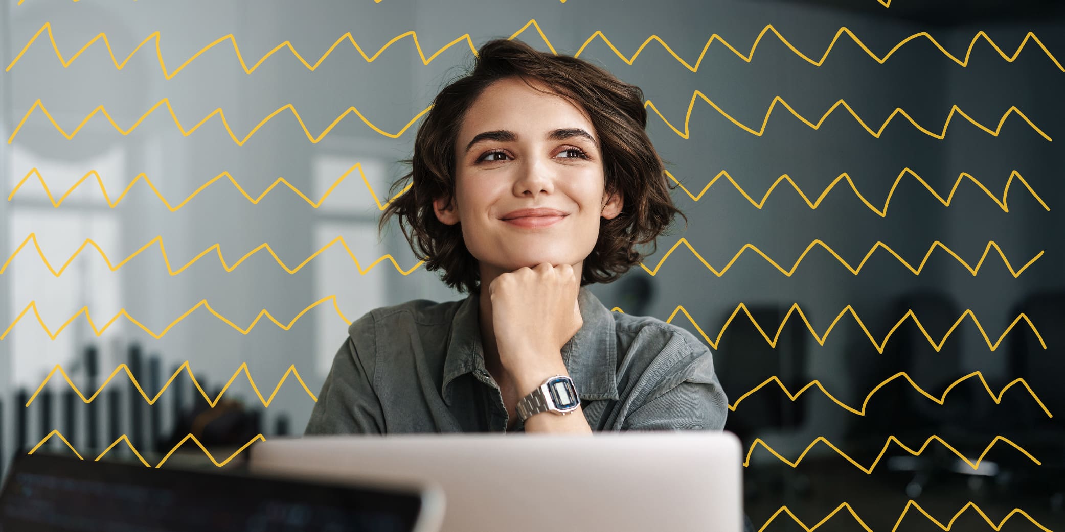 Young Beautiful Joyful Woman Smiling While Working With Laptop in Office