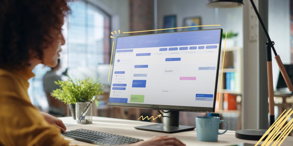 peroson looking a a computer screen with a calendar