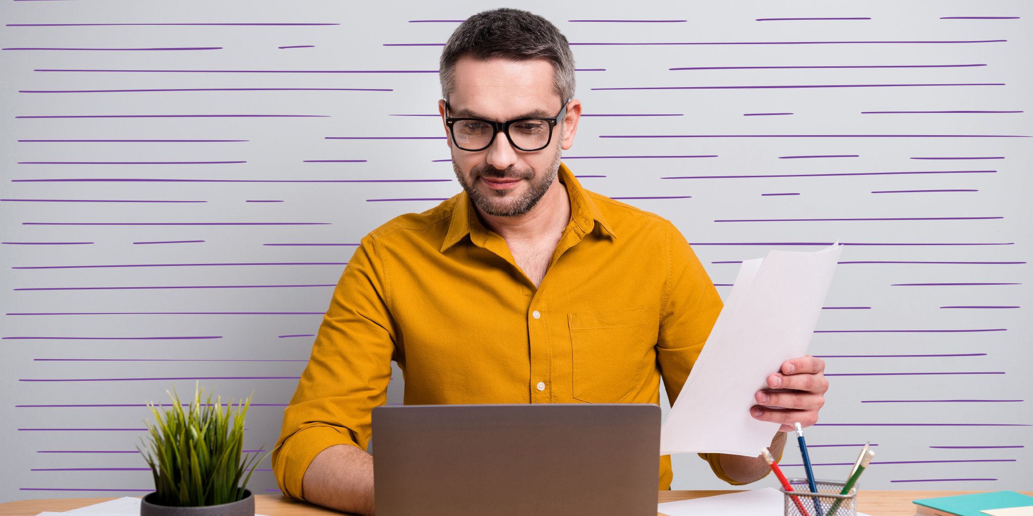 man holding a peper and typing