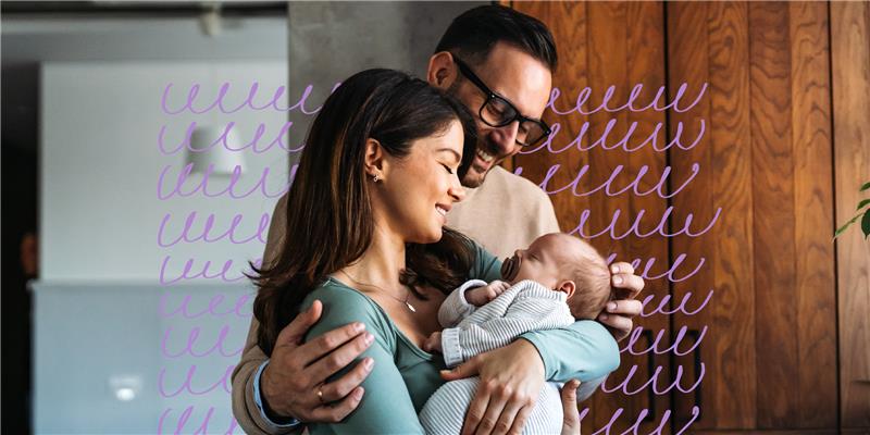 Family holding a baby