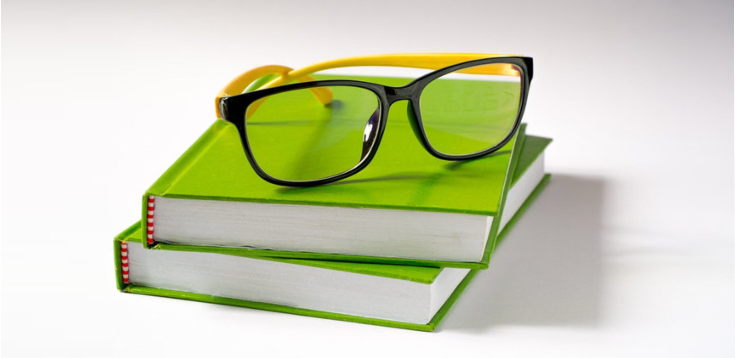 green-books-with-glasses-scaled-1