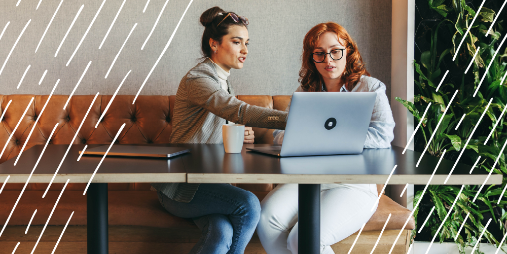 two people looking at a computer