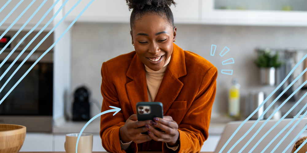 woman smiling looking at her phone