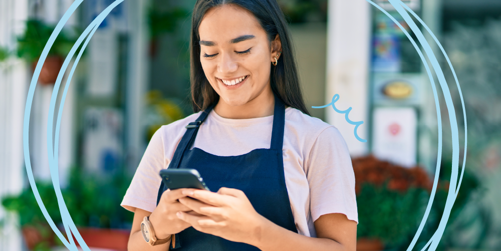 worker smiling while texting