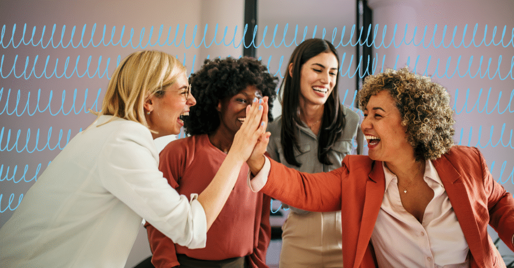 group of business women high fiving