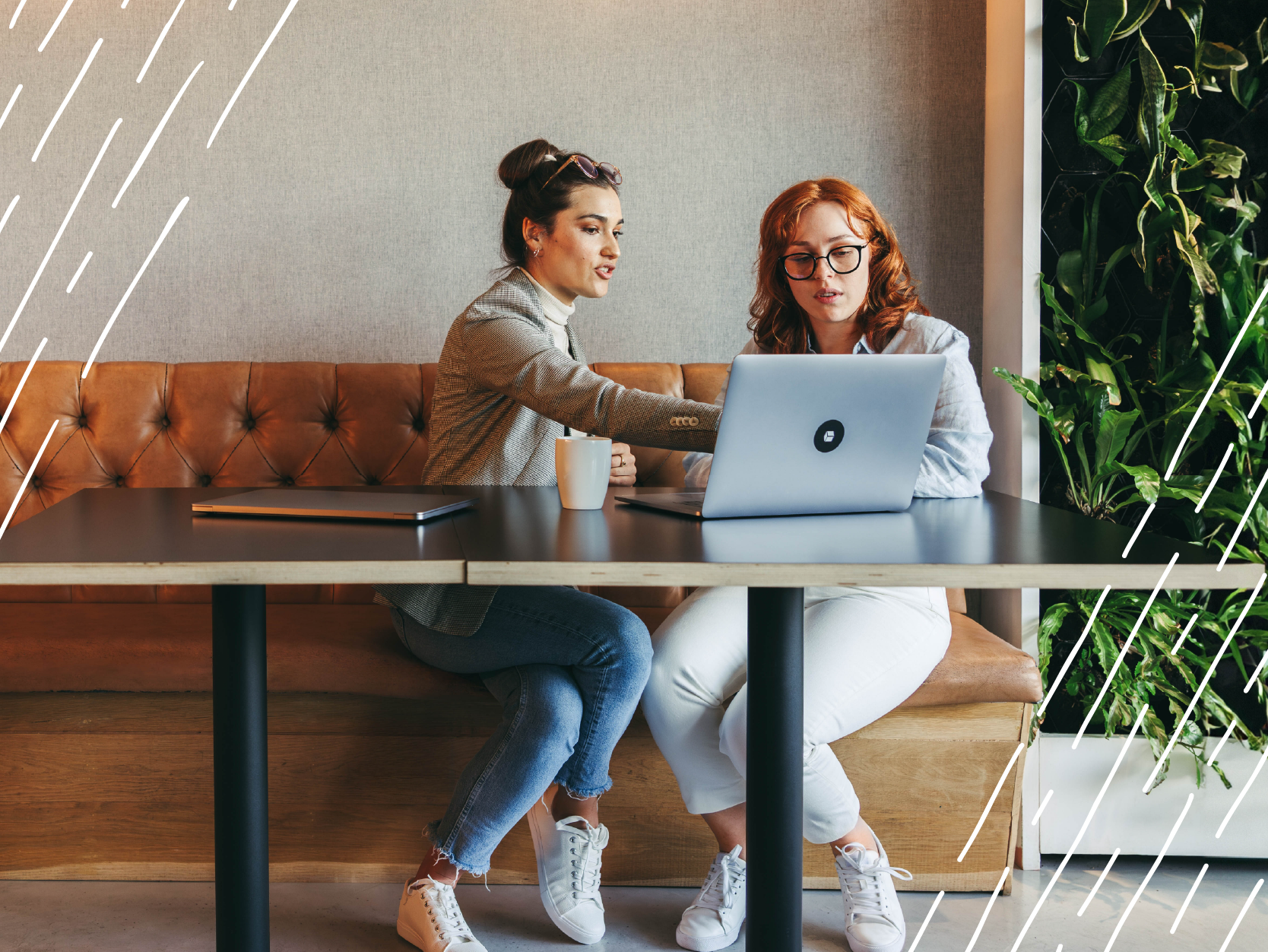 Two women working together at cafe