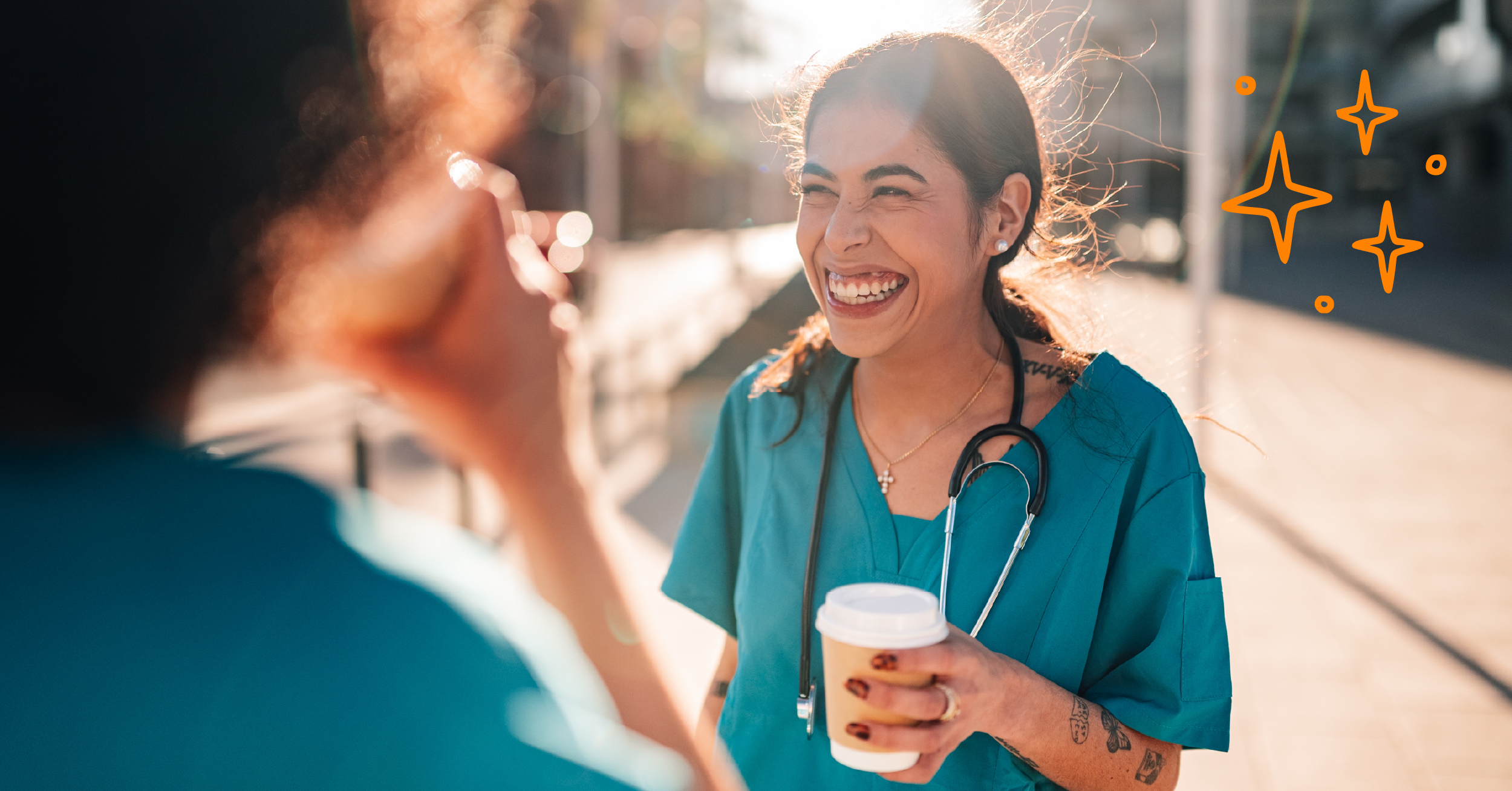two health care workers having coffee